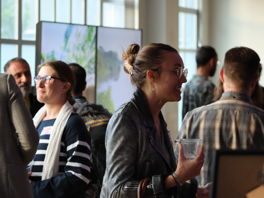 Attendees networking in the Digital Jungle event space